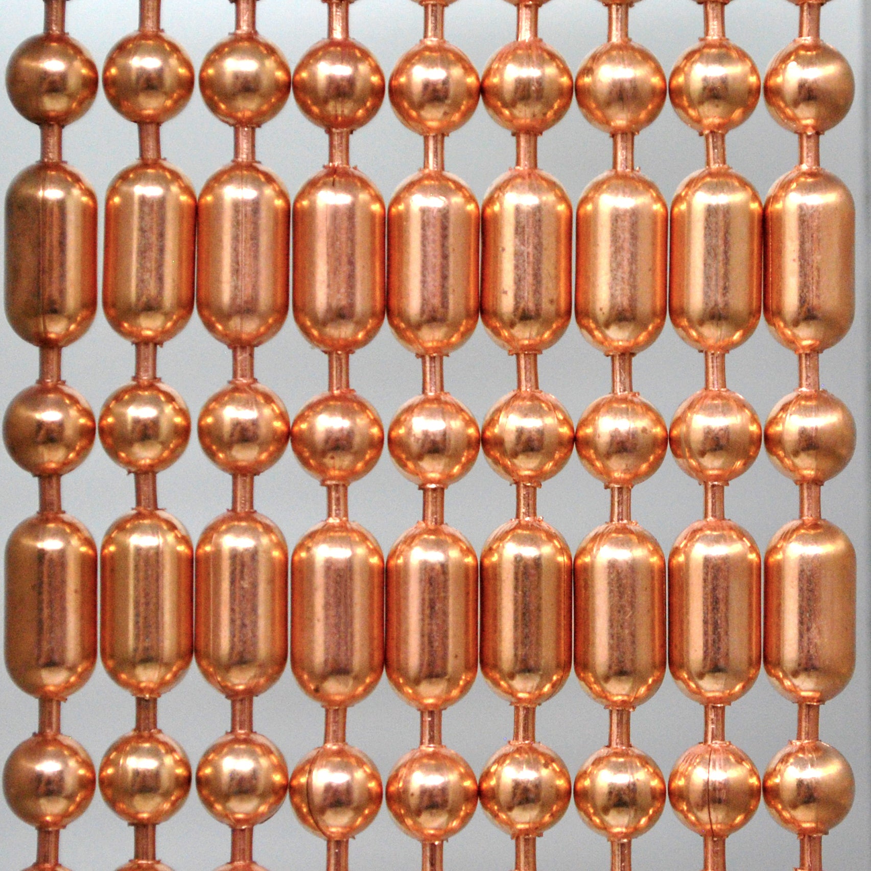 Copper or copper plated Ball-Bar metal ball chain hanging vertically