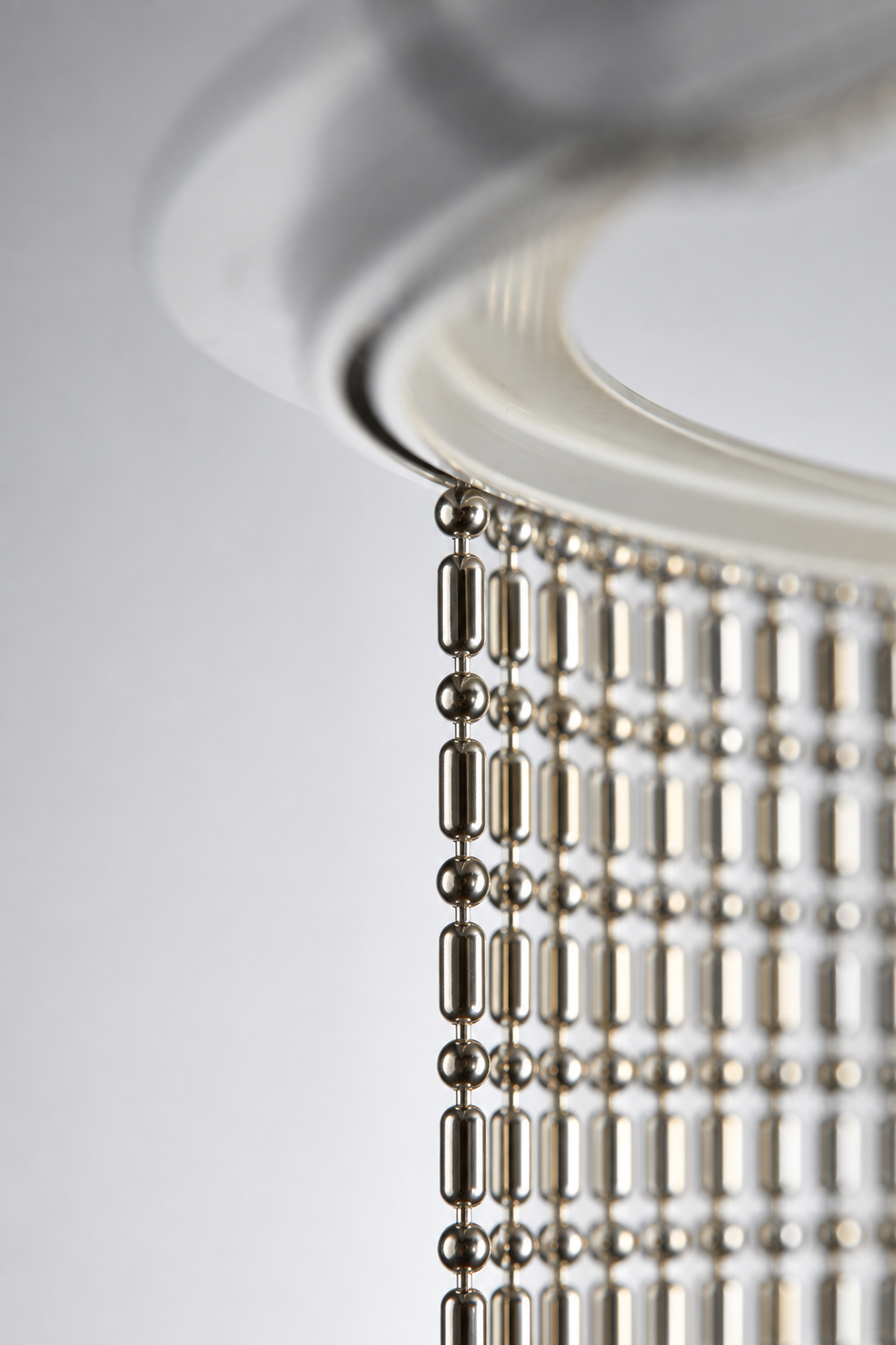 Nickel Plated or Aluminum or silver colored Ball-Bar metal ball chain hanging vertically on circular track