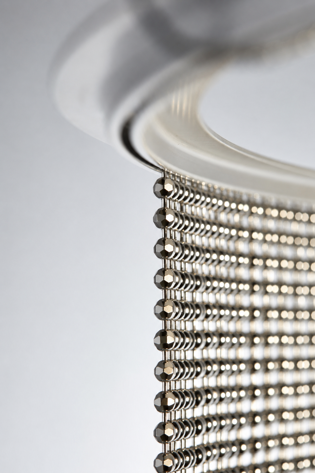 Nickel Plated or Aluminum or silver colored Faceted metal ball chain hanging vertically on circular track